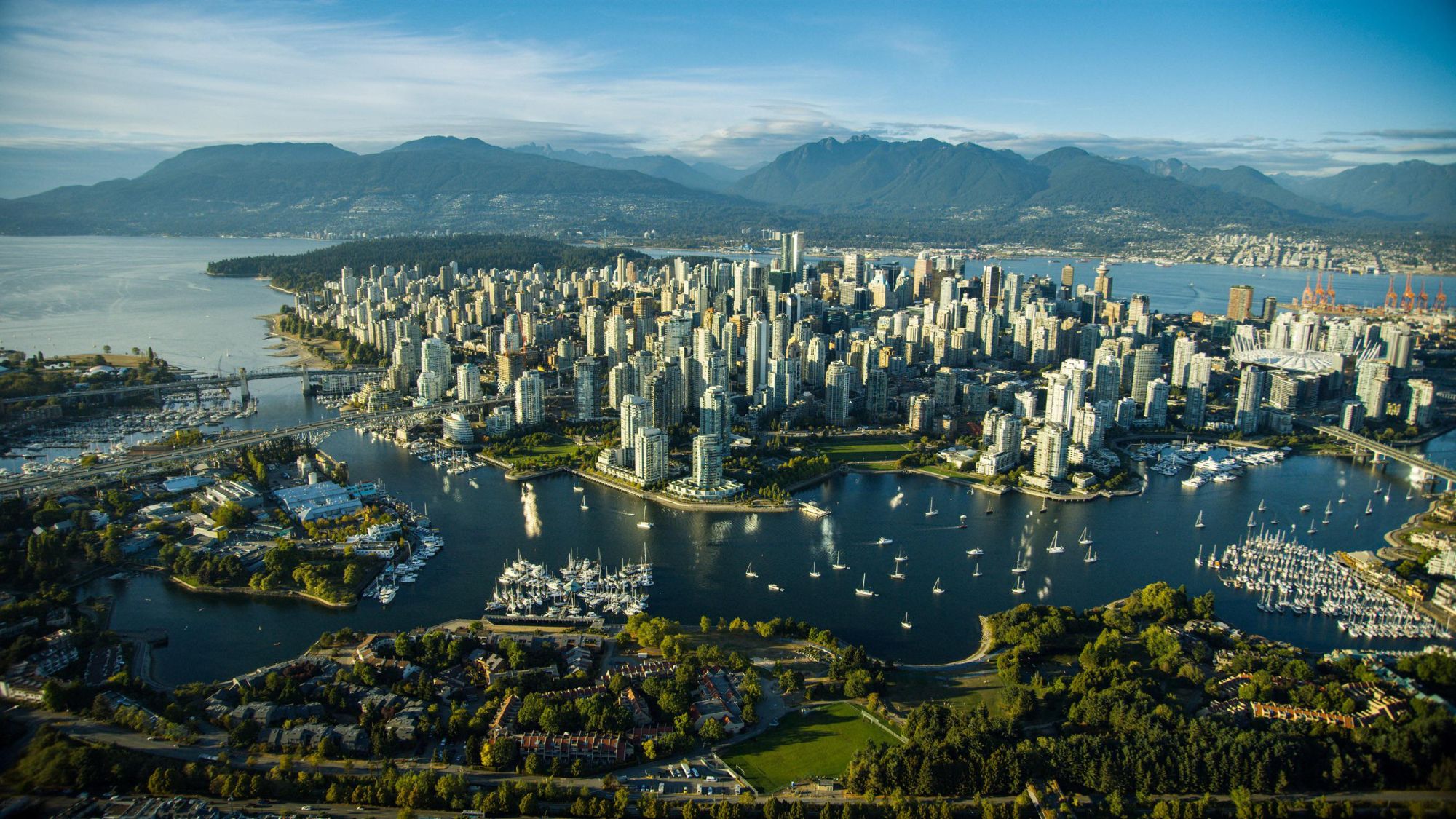 Aerial view of downtown Vancouver, False Creek and the North Shore mountains